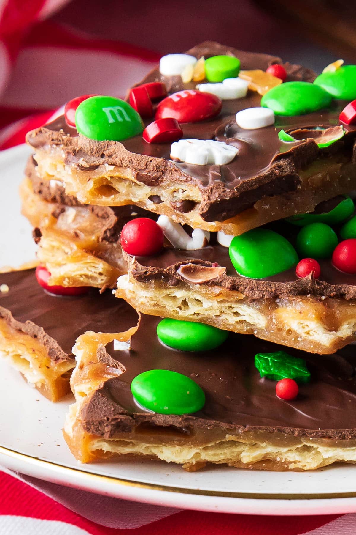Close up of this homemade sweet toffee and saltine cracker treat to showcase crunchy layers and chocolate top