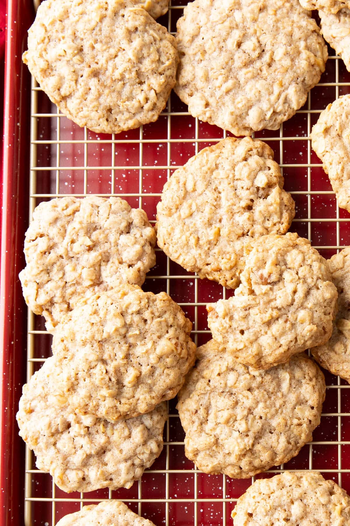 overhead photo of cinnamon oatmeal cookies on a cooling rack.