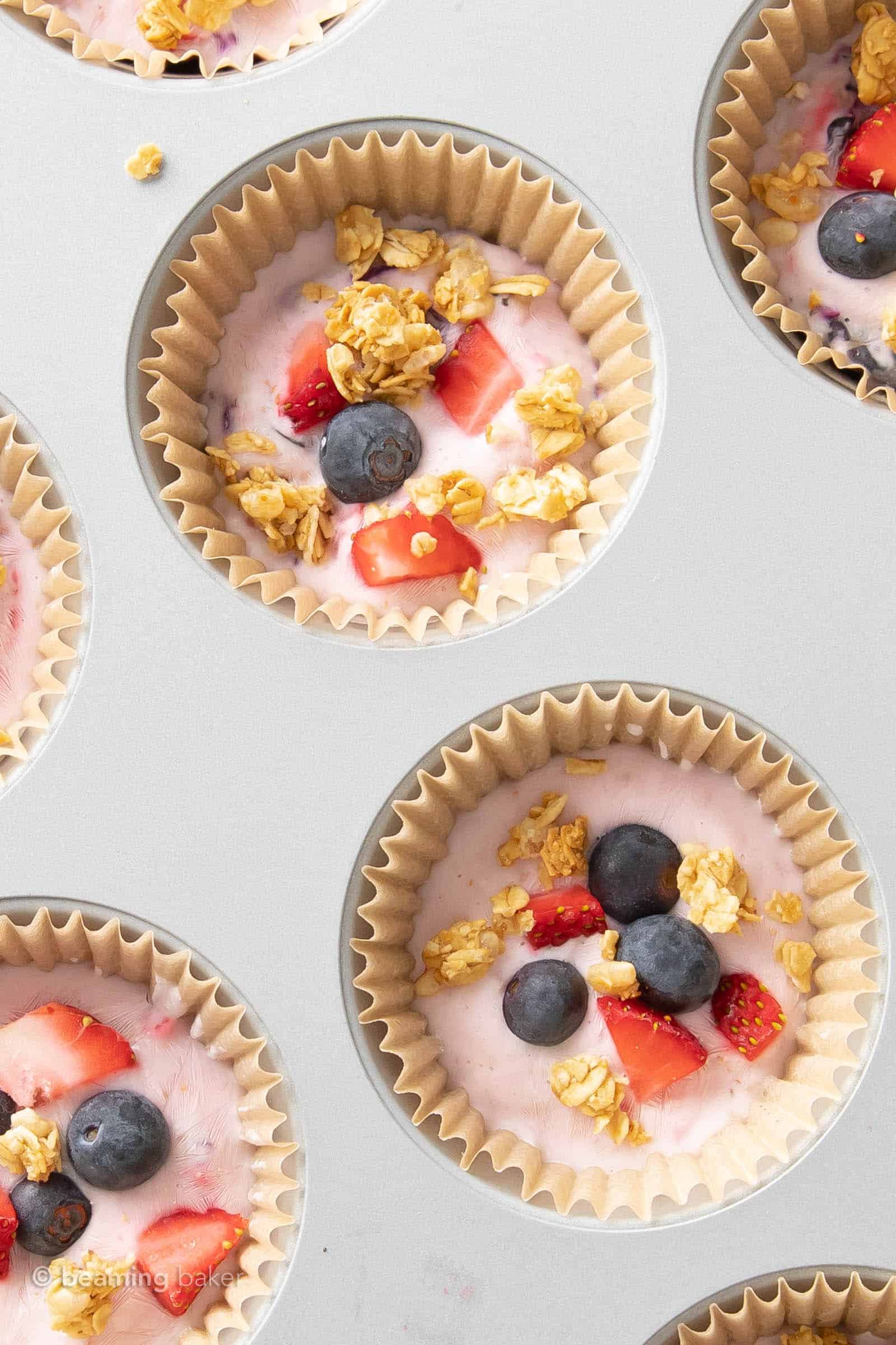 super closeup of two cups filled with frozen greek yogurt bites