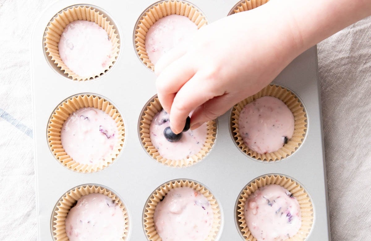 Photo showing how to make this snack recipe – pressing fruits into the tops