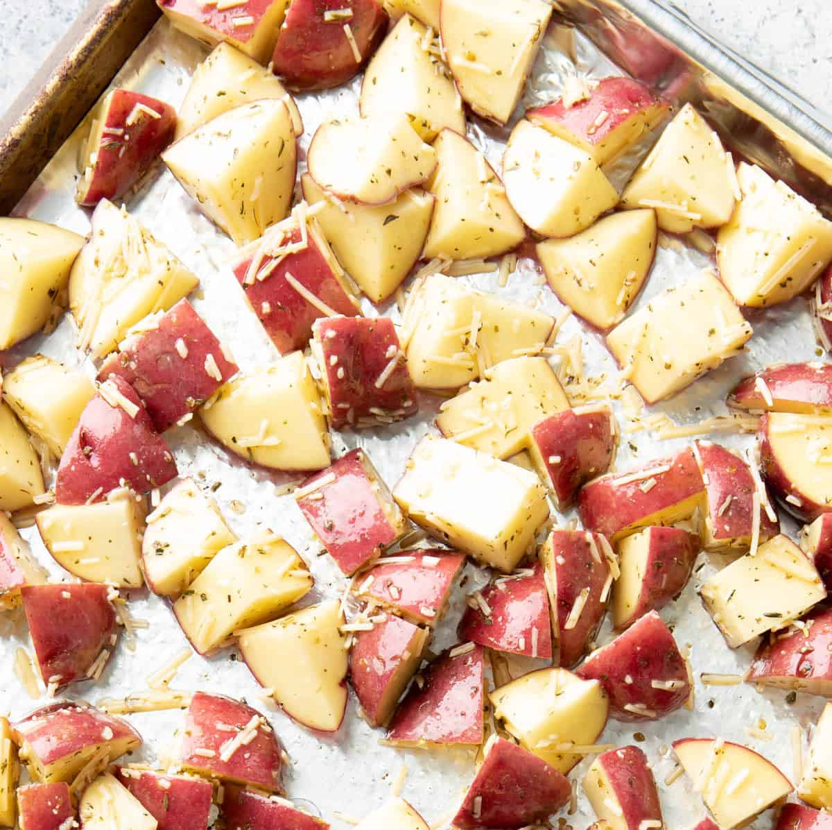Super close up of the ingredients laying in a single layer on the baking sheet