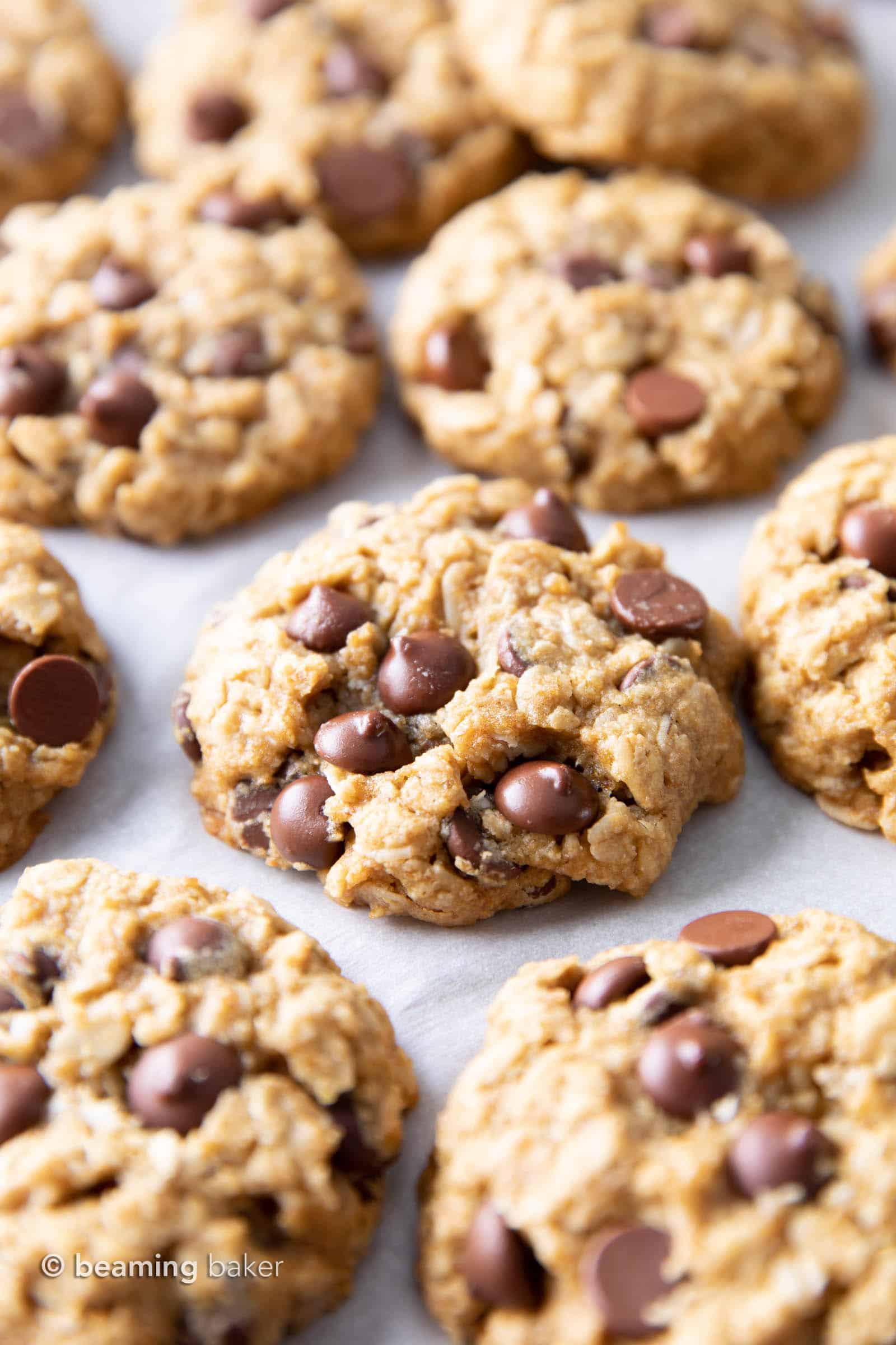 Gluten Free Vegan Oatmeal Chocolate Chip Cookies (GF): a simple vegan oatmeal chocolate chip cookies recipe that yields soft & buttery oatmeal cookies packed with melty chocolate chips! Dairy-Free, Refined Sugar-Free. #OatmealCookies #GlutenFree #Vegan #ChocolateChip | Recipe at BeamingBaker.com
