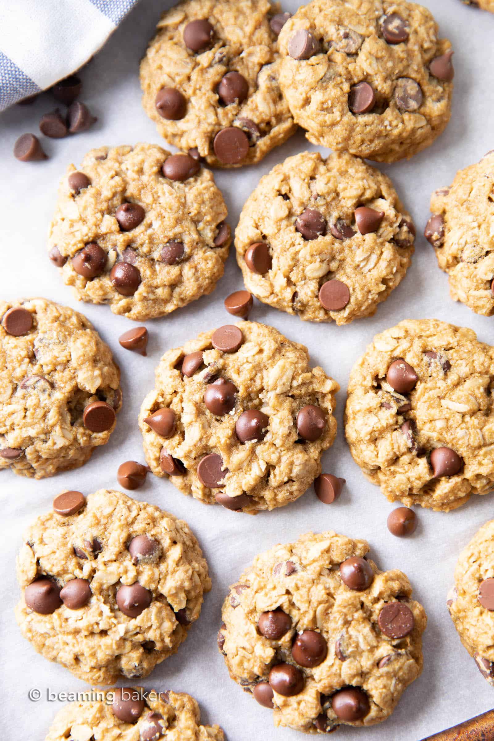 Gluten Free Vegan Oatmeal Chocolate Chip Cookies (GF): a simple vegan oatmeal chocolate chip cookies recipe that yields soft & buttery oatmeal cookies packed with melty chocolate chips! Dairy-Free, Refined Sugar-Free. #OatmealCookies #GlutenFree #Vegan #ChocolateChip | Recipe at BeamingBaker.com