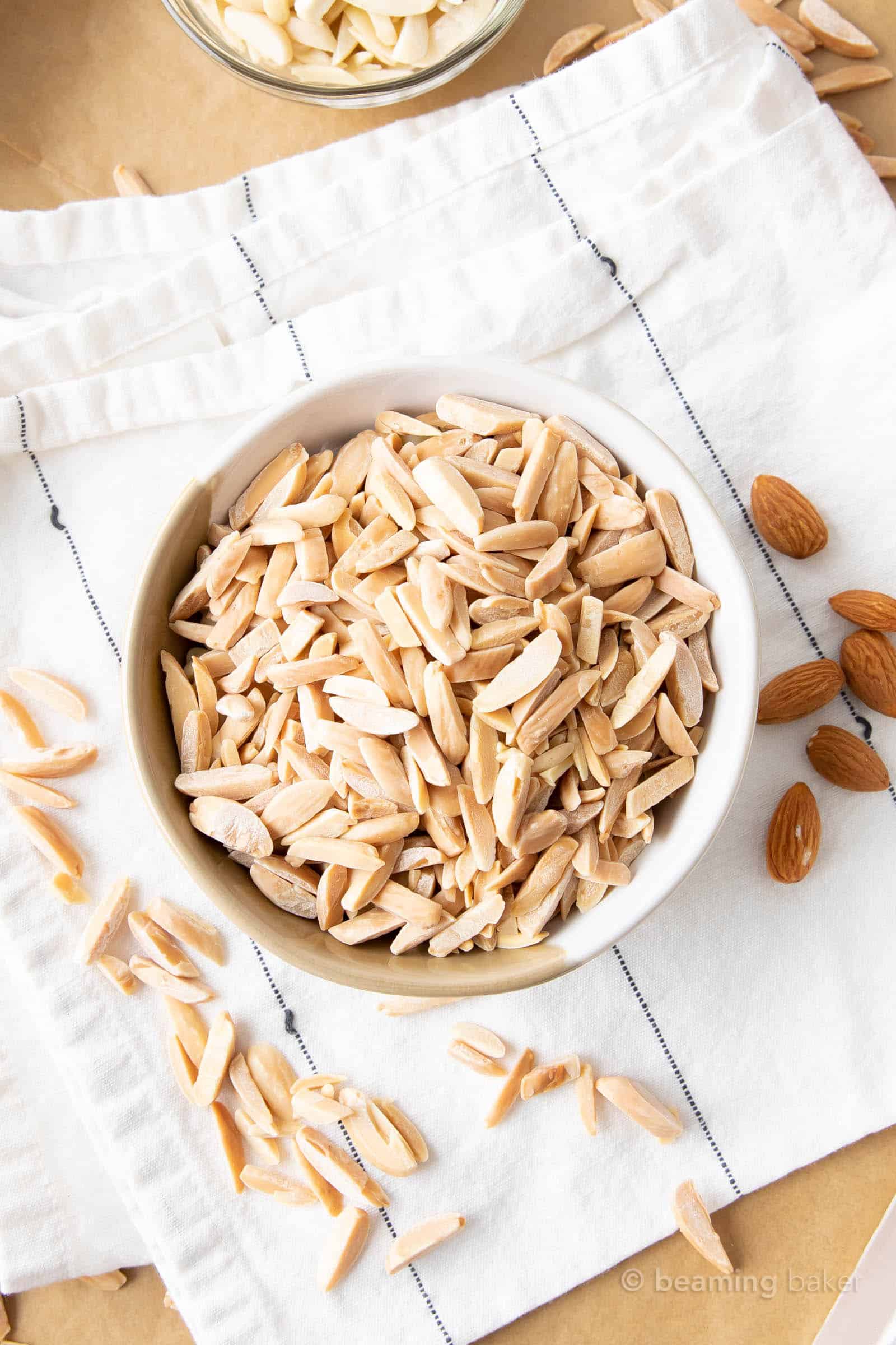 closeup of how to toast slivered almonds in a bowl