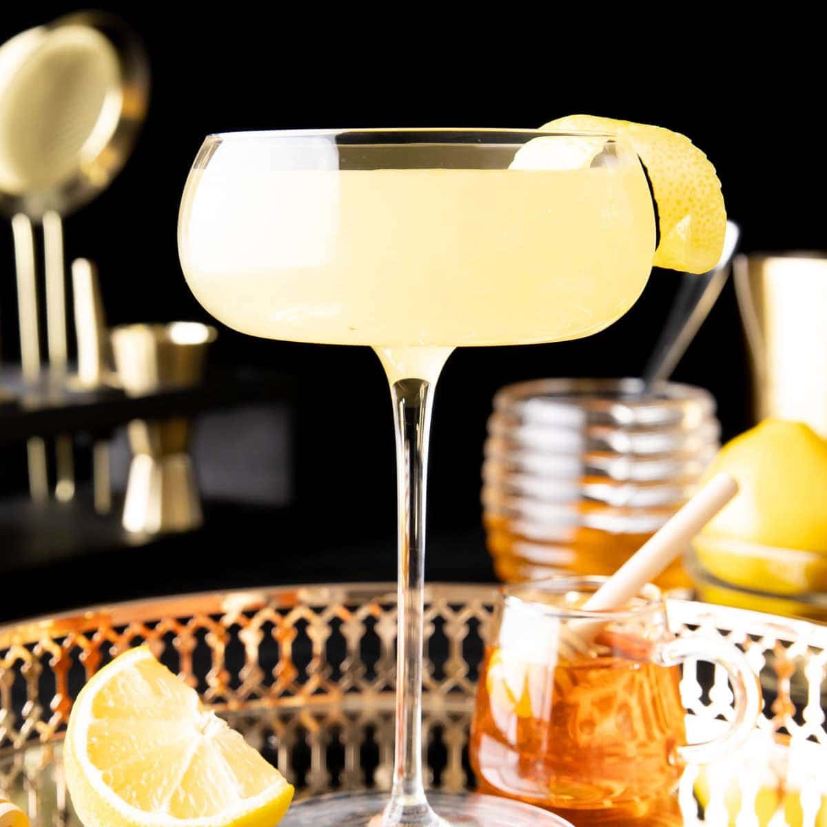 Bee's Knees Cocktail in a glass with a cocktail garnish