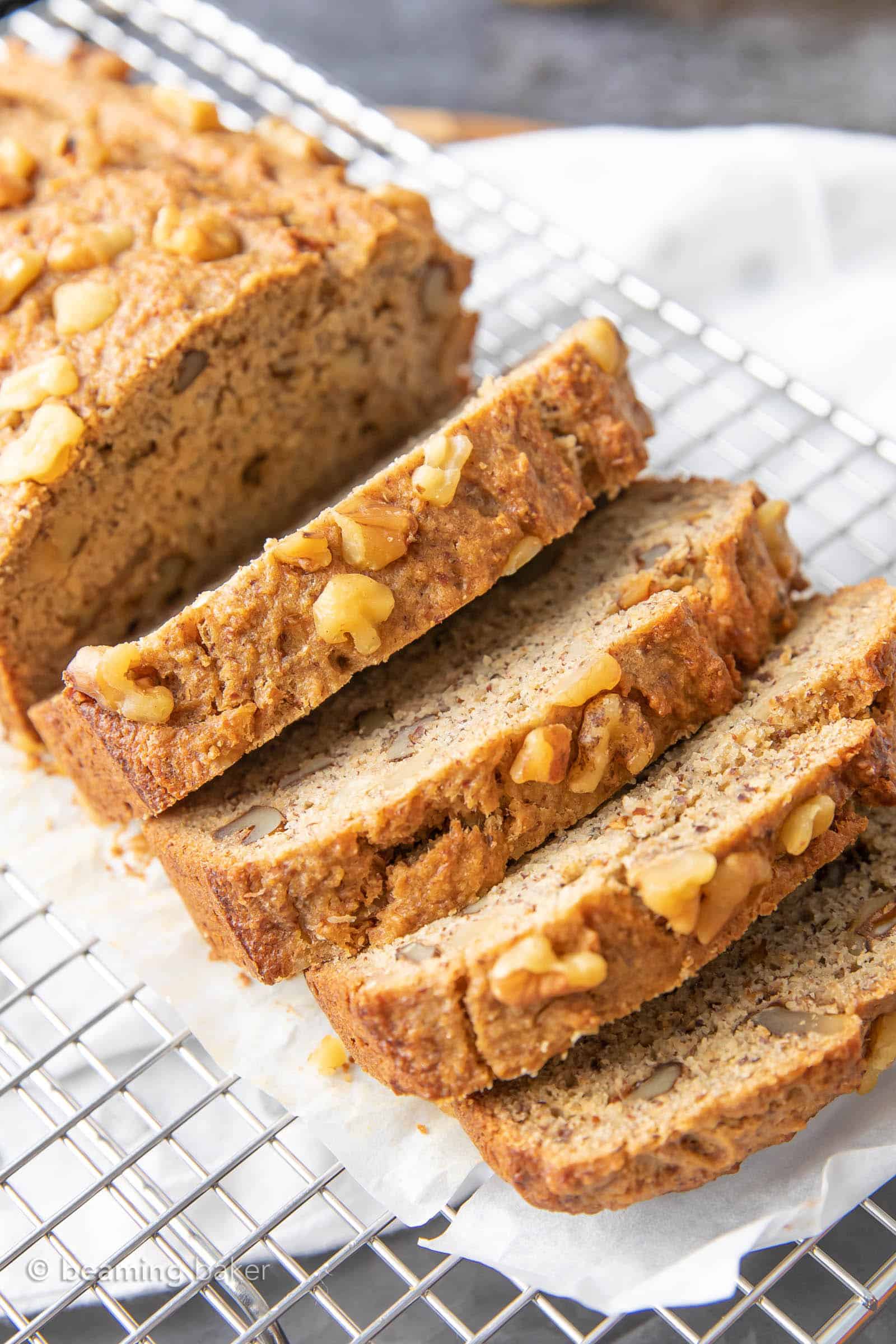 Healthy Banana Bread Recipe: unbelievably delicious banana bread that just so happens to be healthy! Moist ‘n rich with cozy banana flavor and incredible texture—you won’t be able to resist! #BananaBread #Healthy #Banana | Recipe at BeamingBaker.com