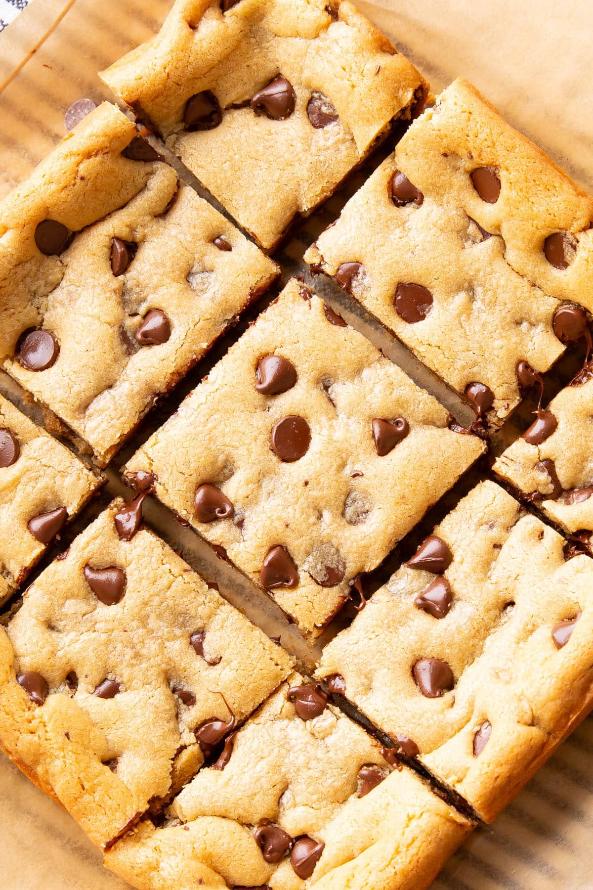 Close up of sliced Peanut Butter Blondies on parchment paper