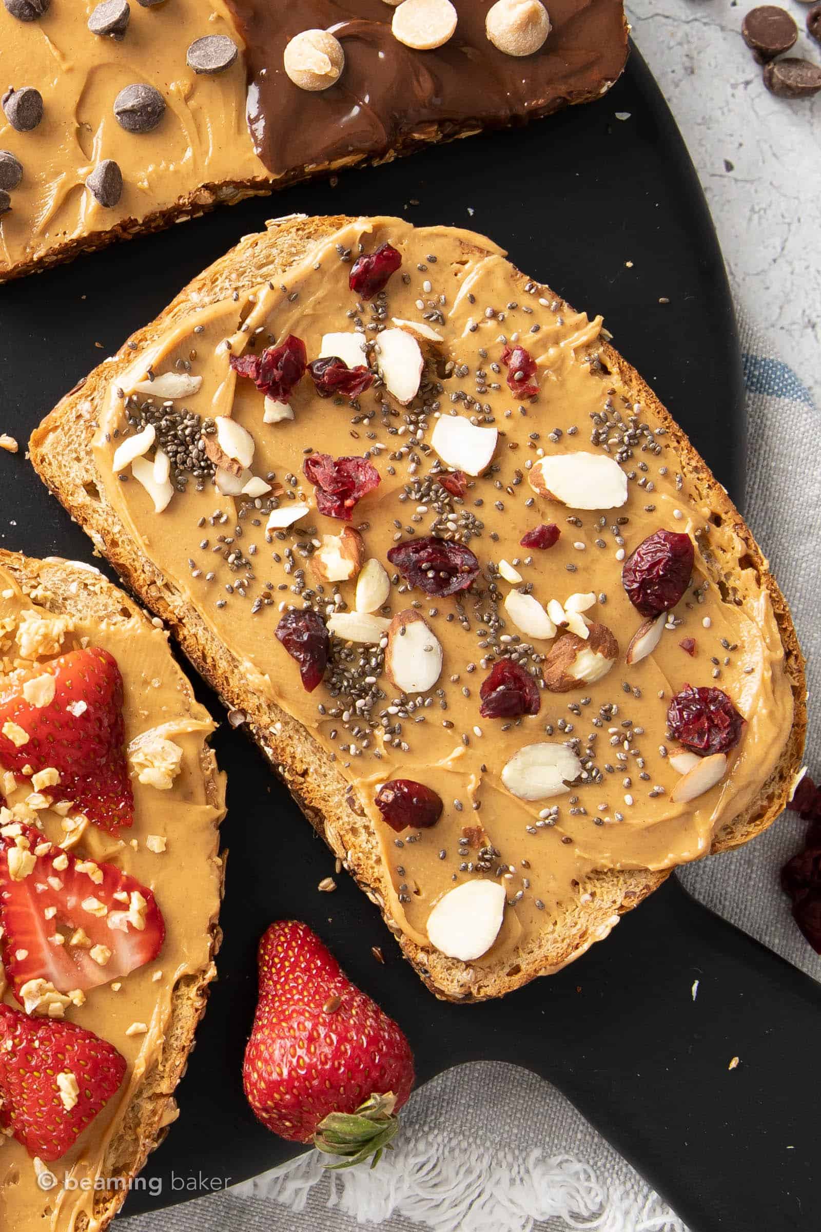 Cranberry Chia Almond peanut butter toast recipe with chia seeds, dry cranberries and almond slices on top