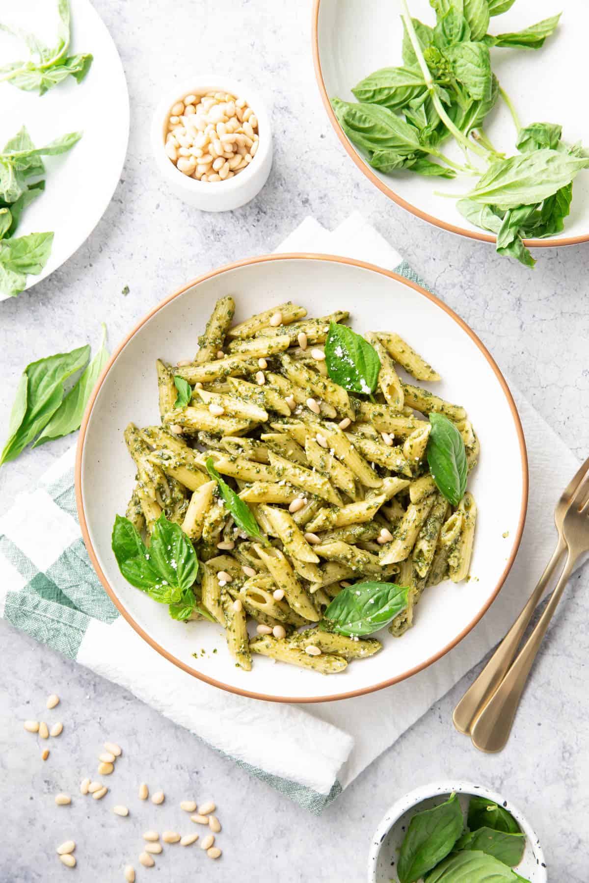 Dining table with this recipe plated and served with fresh basil