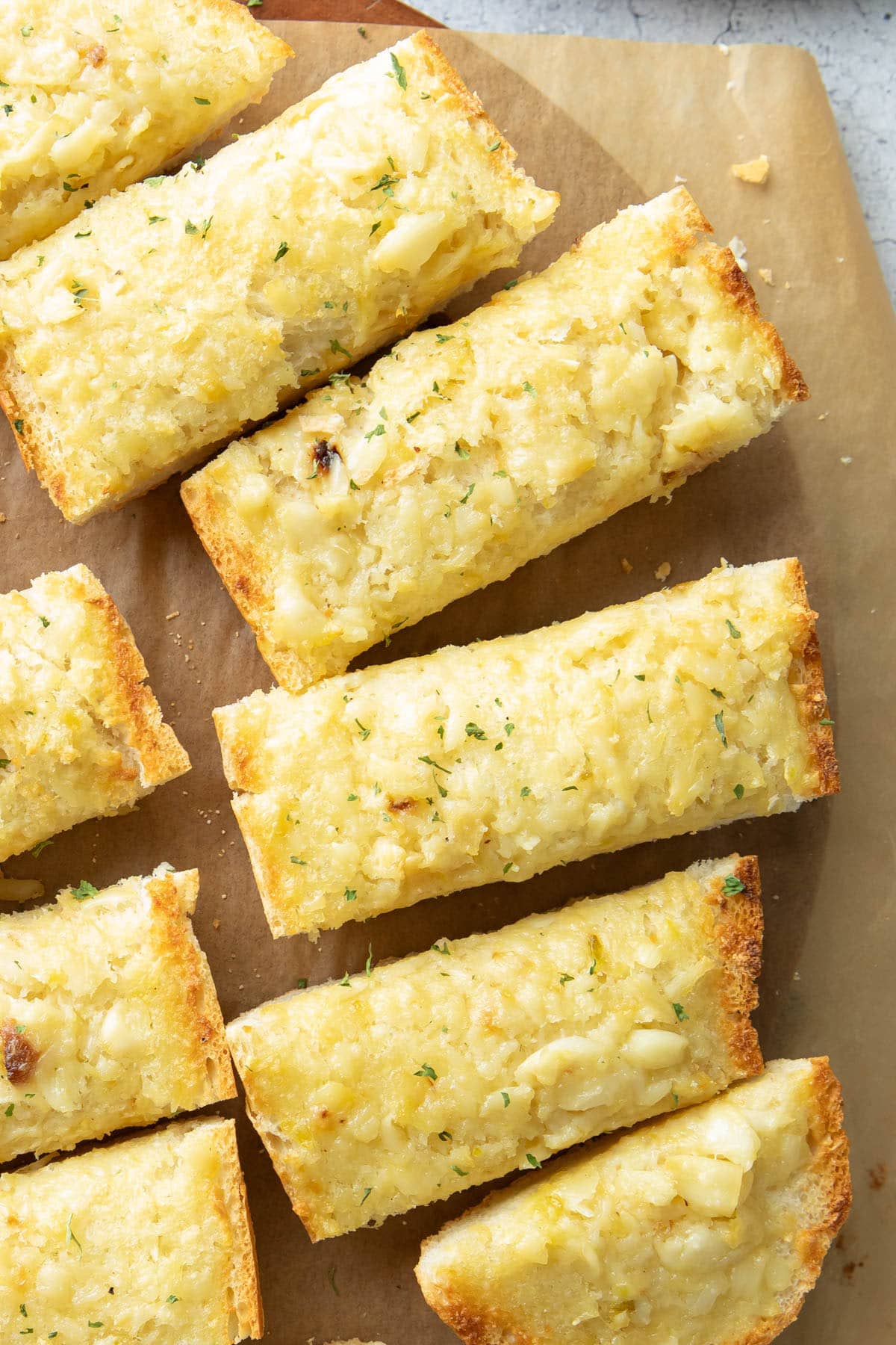 Slices of this finished baked side dish recipe on parchment paper