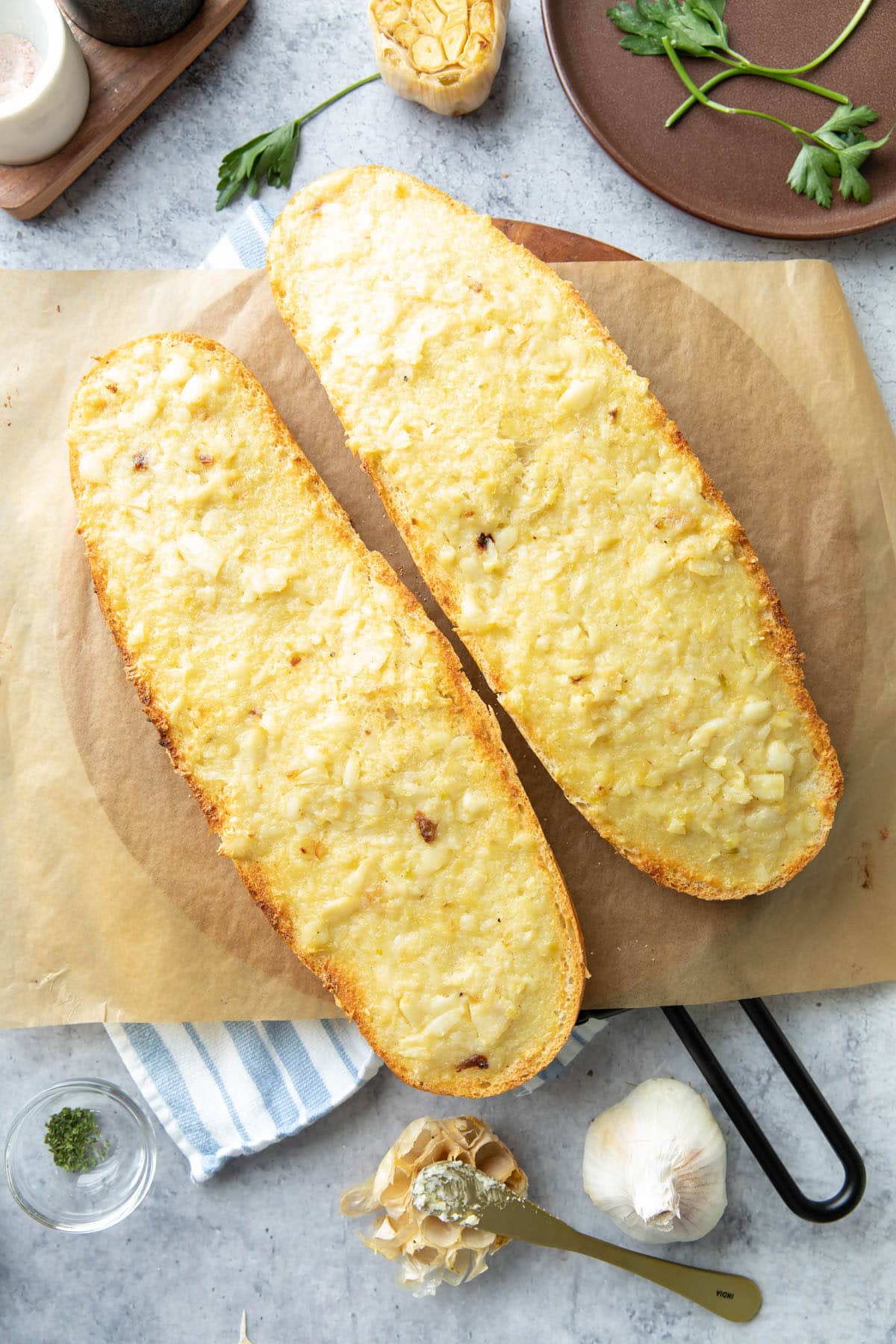 Fully baked loaf halves with spread on serving board