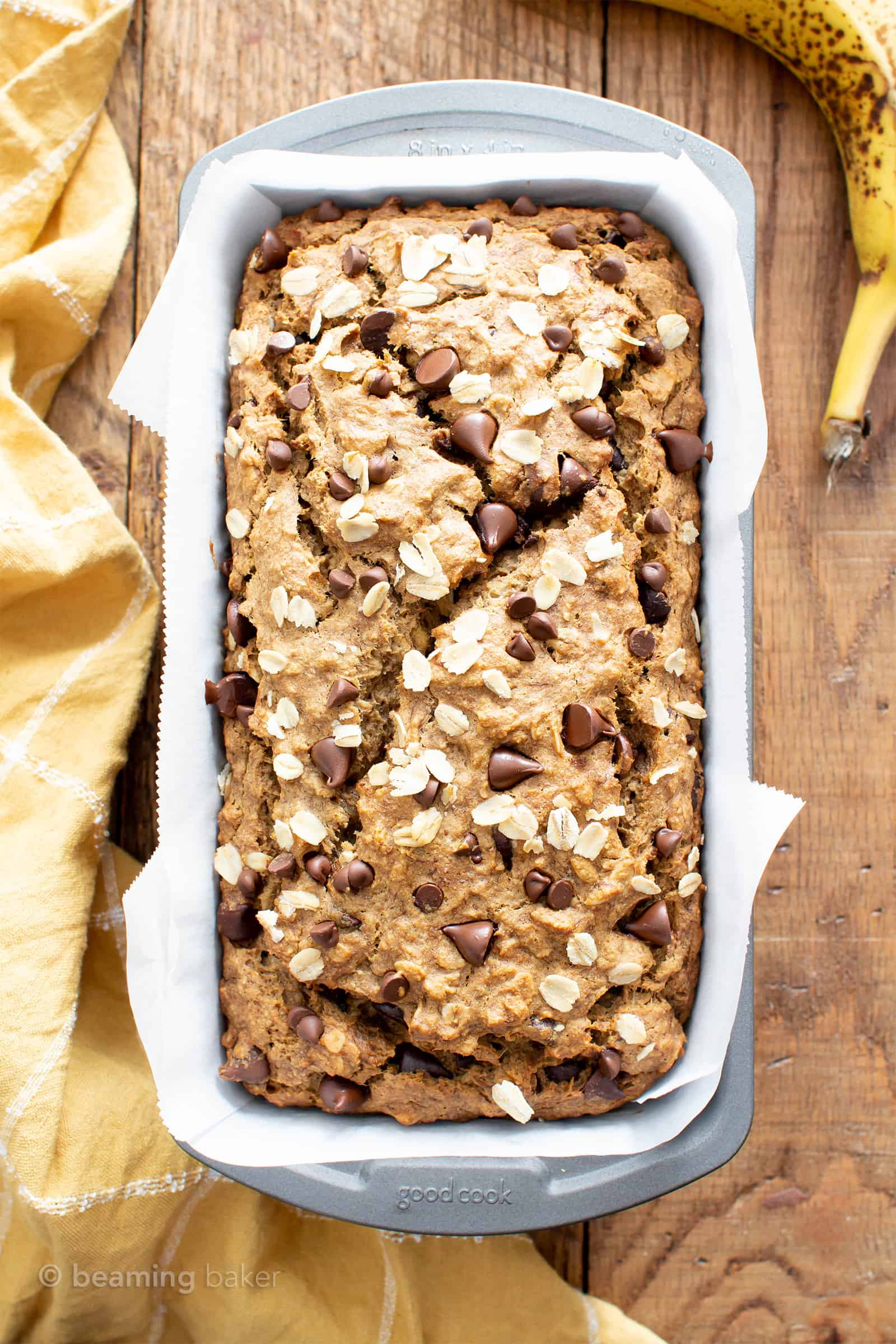 Super Moist Vegan Oatmeal Chocolate Chip Banana Bread (Gluten Free): a healthy banana bread recipe with oats & chocolate! It’s the ultimate vegan oatmeal banana bread—moist, gluten free, dairy-free, made with GF oat flour! #Vegan #Bananas #GlutenFree #Oats #Chocolate | Recipe at BeamingBaker.com